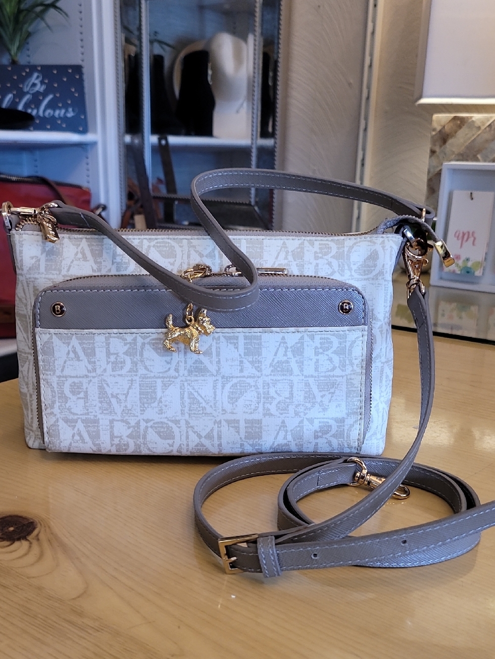 BONIA Logo-Print Beige and Taupe Crossbody Bag with Gold Fox Charm
